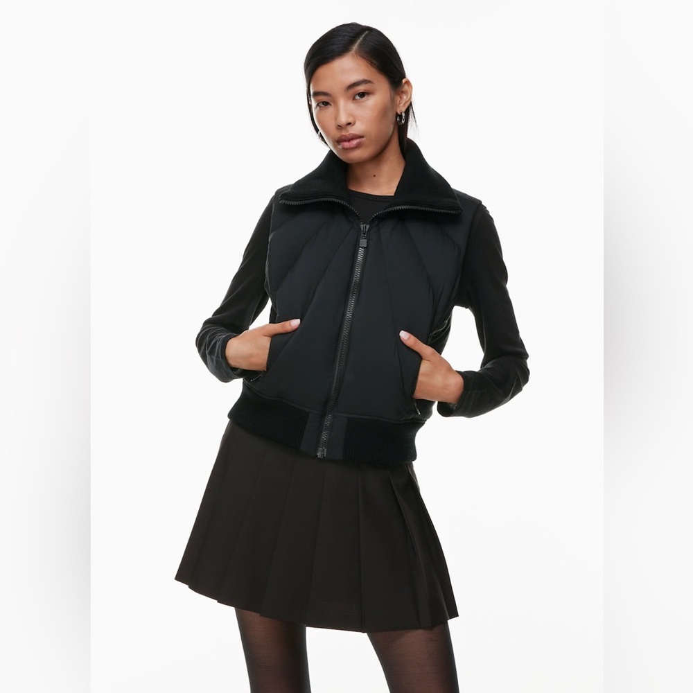 Black puffer vest, après ski style by Sunday Best